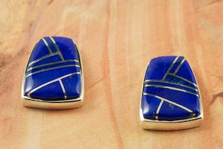 Genuine Blue Lapis inlaid between ribbons of Sterling Silver. Beautiful Sterling Silver Post Earrings Designed by Navajo Artist Calvin Begay. Signed by the artist.